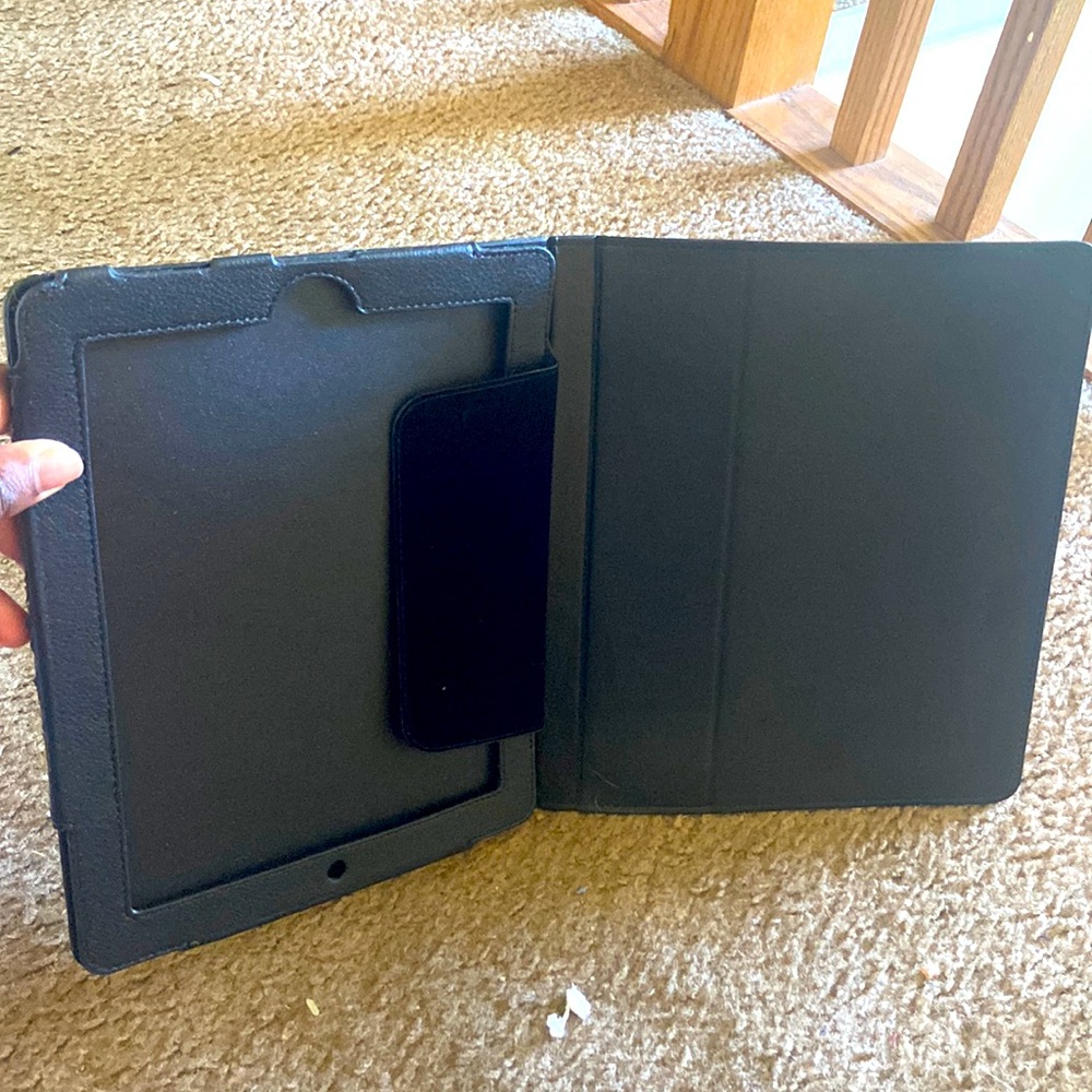 Tablet case. Can easily fit a tablet. Very strong & sturdy